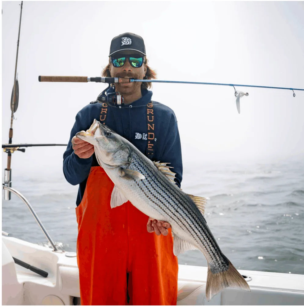 Angler with a striped bass